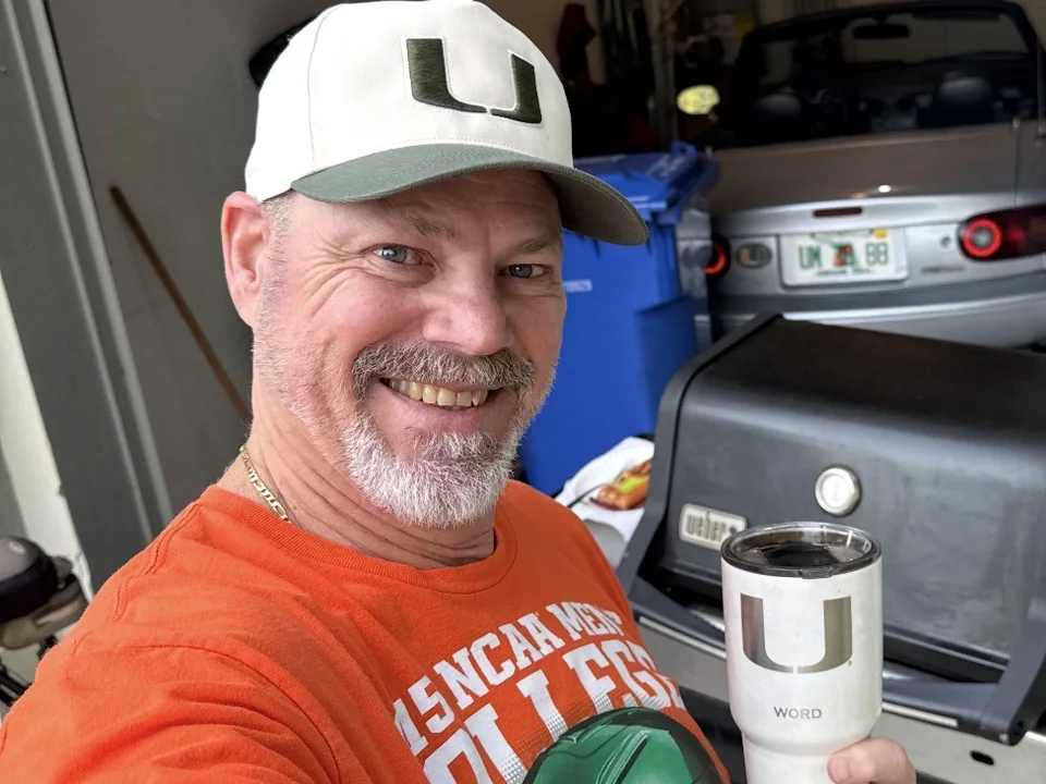 Robbie Word today in Miami Hurricanes gear, holding his WORD tumbler