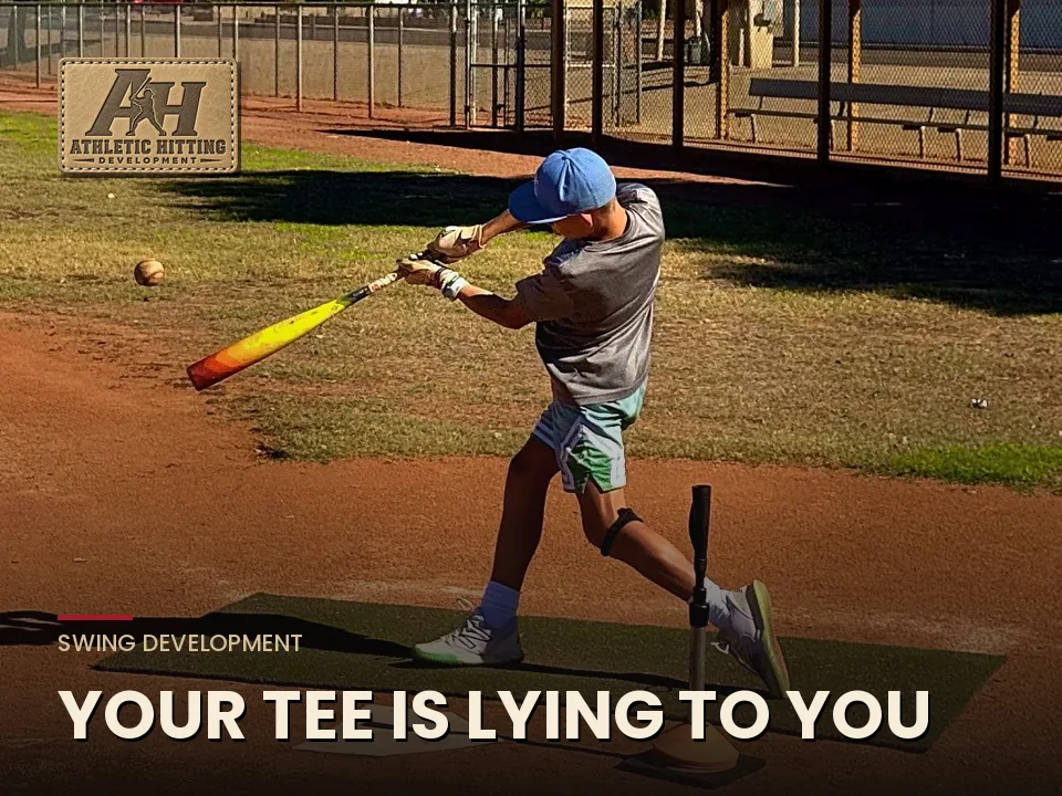 Young hitter swinging through a ball off the tee on a dirt infield